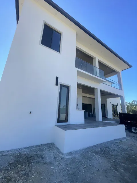The real home, side angle of the back patio